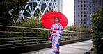 Walking, city and Japanese woman with kimono and Tokyo fashion with umbrella and urban bridge. Traditional, custom and local clothes with heritage and outfit in Japan with path and explore outdoor
