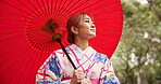 Kimono, peace and woman with umbrella, forest and travel for fresh air, exploring and calm in nature. Spring, traditional and clothes for culture, park and outdoor with smile and person in Japan