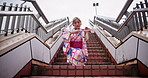 Dance, heritage and steps with woman in city for art, creative or expression of Japanese culture. Kimono, motion and tradition with Asian person in urban town for choreography, energy or rhythm