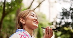Happy, asian woman and nature with speaker phone at park for communication or audio message. Japanese, female person or conversation with mobile smartphone app for voice note or recording in forest
