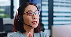 Asian woman, agent or call center with headphones for telemarketing or customer service at office. Japanese, female person or consultant with headset for telecommunications, online advice or help