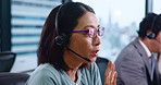 Asian woman, agent and consulting with headphones at call center for customer service or support at office. Japanese, female person or consultant talking with headset for online advice or assistance