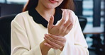 Joint pain, care and hands of woman in office with arthritis, physiotherapy and stretching for relief. Business person, wrist injury and osteoporosis in Japan company with carpal tunnel syndrome 