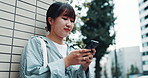 Japan, thinking and city girl with cellphone, typing and connection with ideas. Asian woman, outdoor and person with smartphone, calm and urban town with online reading, wonder and message to contact