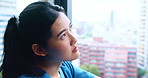 Sad nurse, woman and thinking by hospital window with depression, surgery anxiety and doubt in city. Medical, professional and thoughtful in Japanese clinic for healthcare challenge and overwhelmed