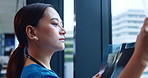Woman, doctor and xray on window for healthcare, patient results and study in Japanese hospital. Radiologist, expert and radiograph in clinic for spinal care, osteoporosis diagnosis and arthritis
