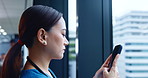 Japanese woman, nurse and mobile phone for connection, internet and online communication in hospital. Female person, technology and scroll for research, website and typing as medical staff in clinic