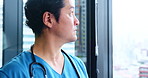 Doctor, paper and thinking in hospital for healthcare, patient information and planning for surgery. Asian man, mature expert and folder in Japanese clinic for problem solving, schedule or cardiology