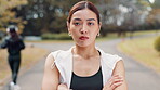 Face, fitness and Japanese woman outdoor with confidence, pride and arms folded. Portrait, athlete and Asian girl at park with determination, serious and workout for body health or wellness in Japan
