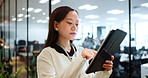 Asian woman, scroll and tablet for networking in office, investment banker and online for advisory. Female person, financial feedback and chat to client for deal, web and message contact in workplace