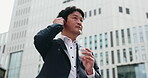 Business man, earphones and music in city for commute, positive attitude and morning with listening. Employee, happy and radio in urban Japan for corporate travel, walk and podcast with streaming