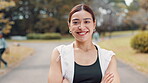 Arms crossed, face and laughing with fitness woman in park for cardio, training or workout. Exercise, portrait and smile with happy Japanese athlete in nature for health, running or wellness routine