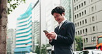 Business man, smartphone and smile in street, thinking and reading for negotiation, deal or texting in city. Person, phone and scroll on mobile app, notification or networking on urban road in Japan