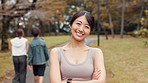 Face, fitness and Japanese woman at park with confidence, laugh and arms folded. Portrait, athlete and Asian girl outdoor with smile, happy and ready to workout for body health or wellness in Japan