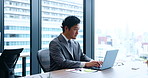 Japanese businessman, laptop and typing for email. communication or report as accountant in company. Male person, technology and working with research, networking and proposal for financial planning