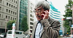 Urban, phone call and mature business man with outdoor discussion, glasses and salaryman on morning commute. City, contact and Japanese businessman with smartphone communication, networking or chat