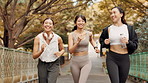 Excited, women and running in city for fitness, exercise or cardio training in Tokyo. Japanese people, friends or happy on urban bridge for workout goal, routine or marathon achievement with progress