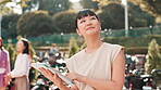 Tablet, thinking or Asian woman in town for research, travel or real estate agent reading news. Smile, businesswoman or happy realtor in city for online listing, ideas or urban development.in Japan