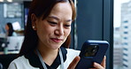 Asian woman, typing and phone for finance in office, investment banker and online for advisory. Female person, financial feedback and chat to client for deal, window and message contact in workplace