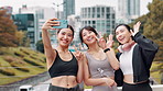 Happy, asian women and selfie with peace sign in city for photography, picture or memory together in fitness. Japanese, female people or friends with smile or emoji for capture on bridge in town