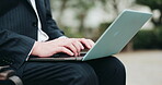 Man, hands and typing on laptop in city, lawyer and outdoor consulting on legal policy or info. Male person, attorney and urban town of Japan for case research, email contact and website for law