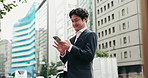 Business man, smartphone and happy in street, thinking and reading for negotiation, deal or texting in city. Person, phone and scroll on mobile app, notification or networking on urban road in Japan