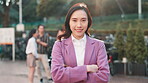 Arms crossed, face and woman with business leader outdoor for confidence or pride in work. Happy, portrait and smile of employee at nature park in Japanese city for corporate team building event