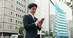 Business man, smartphone and reading in street, thinking ir contact for negotiation, deal or texting in city. Person, phone and scroll on mobile app, notification or networking on urban road in Japan