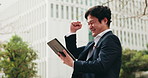 City, winning and business man with tablet, good news and salaryman with happy deal achievement. Urban, street and Japanese businessman on digital app with celebration, online success and promotion