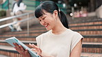 Business, steps and tablet with Japanese woman outdoor in city for break, email or research. Internet, smile and technology with happy Asian employee on stairs for reading information online