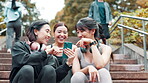 Fitness, phone and steps with athlete friends outdoor together for cardio, training or workout. Break, exercise and smile of Japanese women on stairs for communication, tracking or update with app