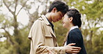 Japanese couple, forehead touch and care in park or countryside for bonding, relationship and love. Woman, man and outdoor for romance, connection and commitment with eyes closed for valentines day