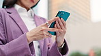 Business, hands and woman with phone in city for online networking, thinking of email feedback or research. Professional, employee and smartphone in Japan to search information, chat and text message