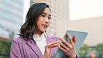 Buildings, business and tablet with Japanese woman outdoor in city for break, email or research. Internet, report and technology with happy Asian employee reading information online in urban town