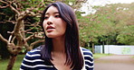 Thinking, peace and Japanese woman in park for reflection, calm and summer vacation. Memory, holiday and morning with asian person walking on nature path for contemplating, idea and adventure