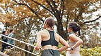 Back, women and running in city for fitness with cardio training, exercise and marathon preparation. Athlete, people and water bottle with stairs workout, energy and practice for competition in Japan