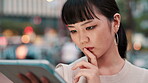 Business, tablet and thinking with Japanese woman outdoor in city for break, email or research. Internet, problem solving and technology with Asian employee reading information online in urban town