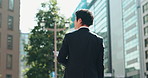 Thinking, architecture and Asian business man in city for morning commute, travel and journey. Professional, urban planning and Japanese person in town with inspiration for career, job and buildings
