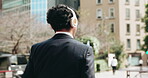 Businessman, dance and walking in city for celebration, positive attitude and energy with headphones. Employee, back and music in Japan town for corporate travel, freedom and commute with streaming
