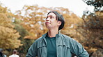 Exercise, smile and thinking with Japanese man in nature park for cardio training or workout. Fitness, inspiration and vision with happy athlete or runner outdoor for health or wellness ideas