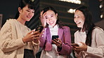 Japanese women, phone and laughing with social media, happy news or comic information in city. Friends, smile and joy with smartphone for networking, funny meme or mobile communication in Tokyo
