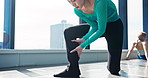 Fitness, woman and dancer stretching legs in studio for health, body wellness and prepare for performance in Japan. Foot, flexibility and girl warm up muscle, hands massage and start calf exercise