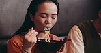 Couple, woman and noodles for eating in restaurant, lunch and bonding together for anniversary. Japanese people, partner and hungry wife with asian cuisine of ramen, food and wellness in relationship