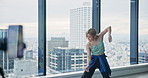 Modern, dance and woman in studio streaming for online tutorial, performance or broadcast on phone. Streamer, contemporary dancer and Japanese girl with video, recording and creative influencer class