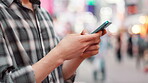 City, hands and typing with smartphone outdoor for online networking, text message and email response. Japanese person, phone and closeup with internet search for travel location and urban town map