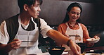 Woman, Japanese man and serving dish for healthy meal, food and traditional cuisine as couple. Happy people, cooking and chopsticks for culinary culture, dinner or preparing dish in Asian restaurant
