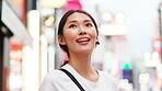 Japanese woman, travel and wow in city for tourist, sightseeing and exploring for weekend trip. Smile, adventure and happy person commuting with urban town, holiday and destination  for vacation