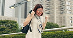 Japanese woman, outdoor and mobile phone with success, surprise and celebration in street or city. Female person, winner and happiness on technology for connection, social media app and communication