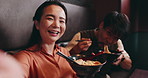 Couple, face and selfie with food in restaurant, bonding and celebration for anniversary with smile. Japanese people, man and woman in portrait with photography, picture and eating noodles on date
