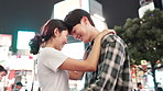 Night, happy couple or hug in Japan city for travel, love or commitment in healthy relationship. Japanese people, laugh or forehead touch in urban Kyoto for special moment, trust or support with care